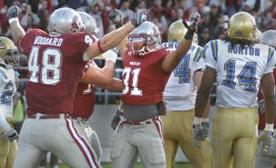 WSU tight end Ben Woodard, left, celebrates as running back Dwight Tardy scores a touchdown on a one yard run in the first quarter.
(CHRISTOPHER ANDERSON / The Spokesman-Review)