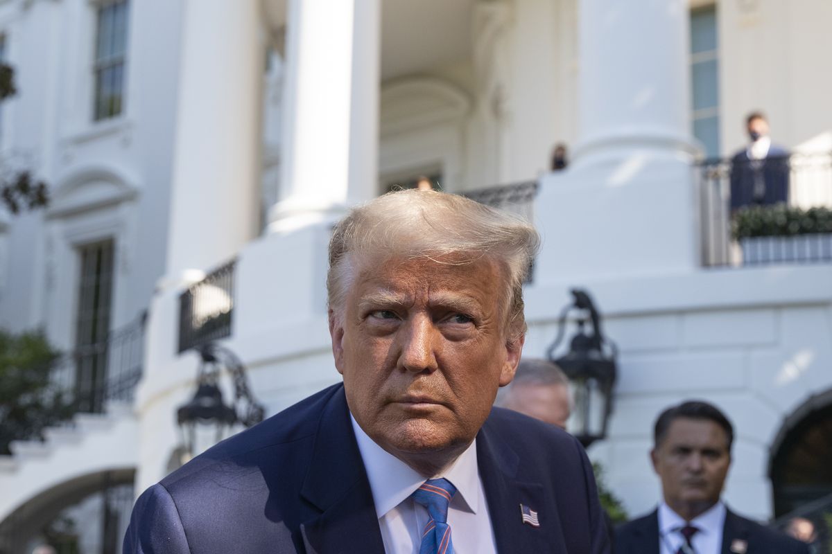 President Donald Trump leans in to hear a question as he speaks with reporters before walking to Marine One on the South Lawn of the White House, Wednesday, July 29, 2020, in Washington. Trump is en route to Texas.  (Alex Brandon)