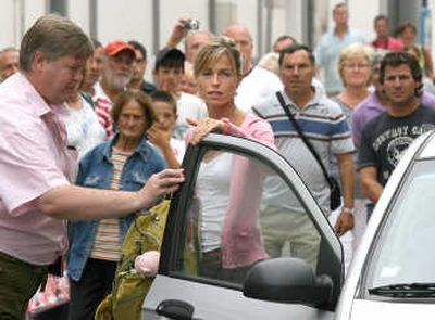 
Kate McCann, the mother of missing Madeleine McCann, arrives at the police station in Portimao, Portugal, to be questioned Friday. Associated Press
 (Associated Press / The Spokesman-Review)