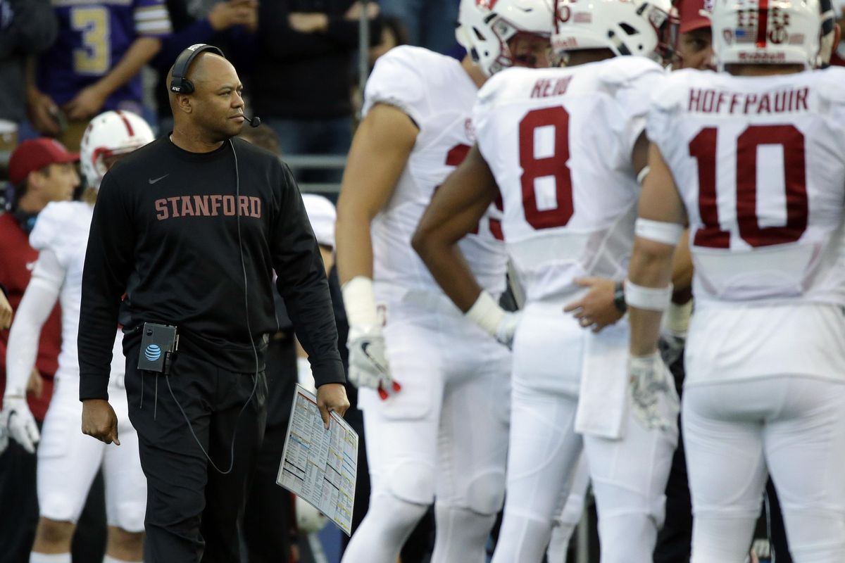 Stanford head coach David Shaw, left, walks near his team during a timeout in the first half of an NCAA college football game against Washington, Friday, Sept. 30, 2016, in Seattle. (AP Photo/Ted S. Warren) ORG XMIT: WATW119 (Ted S. Warren / AP)