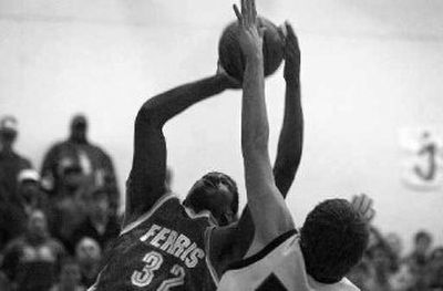 
DeAngelo Casto works around a Gonzaga Prep defender. The Ferris junior finished with 14 points.
 (Holly Pickett / The Spokesman-Review)