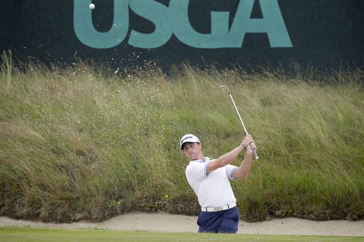 Cole Miller hits out of a bunker during a practice round for the U.S. Open Golf Championship, Wednesday in Southampton, N.Y. (Seth Wenig / AP)