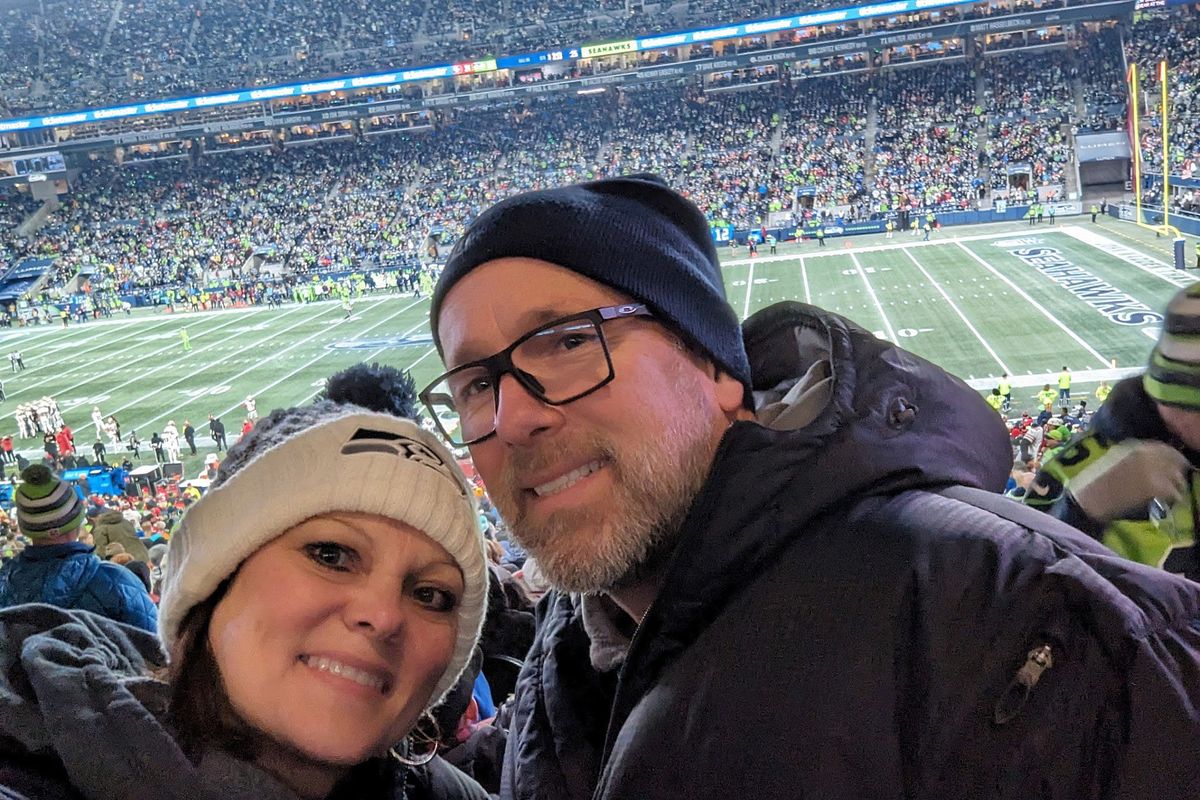 Jodi and Joe Hoffman stop to take a selfie while at a Seahawks regular-season game.  (Courtesy of the Hoffmans)