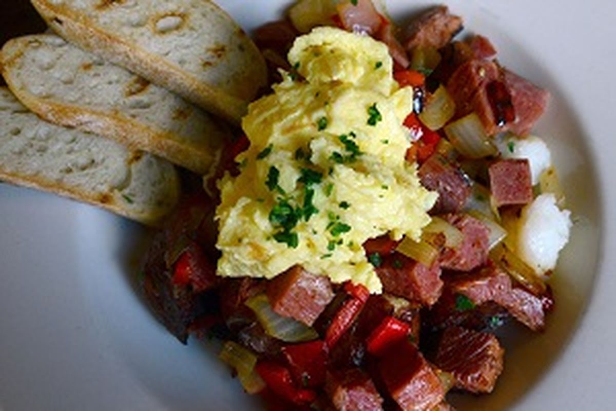 The corned beef hash at Downriver Grill features house-braised corned beef, smash-fried herb potatoes, red peppers, grilled bread and two eggs for $13. (Liz Kishimoto / Liz Kishimoto/The Spokeesman-Review)