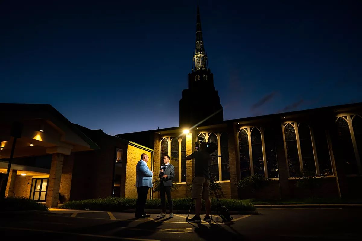 A television news crew interviews City Clerk Joel Hondorp outside a church in Grand Rapids, Michigan.    (Kent Nishimura/Los Angeles Times/TNS)
