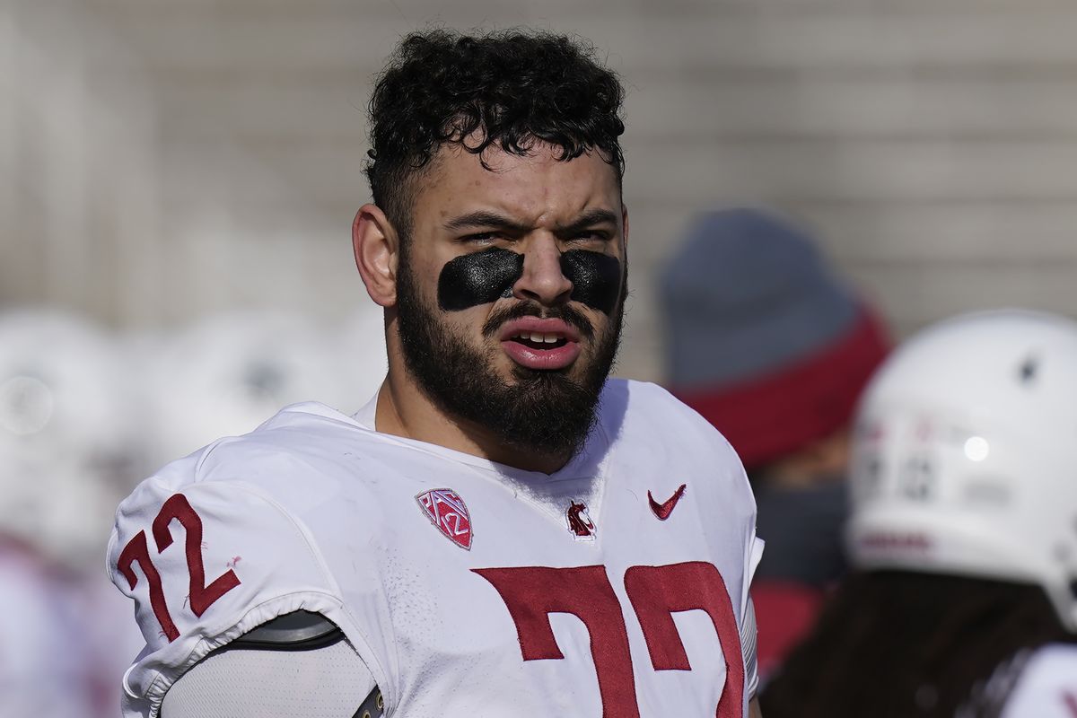 Washington State offensive lineman Abraham Lucas (72) looks on during the first half of an NCAA college football game against Utah Saturday, Dec. 19, 2020, in Salt Lake City.  (Associated Press)