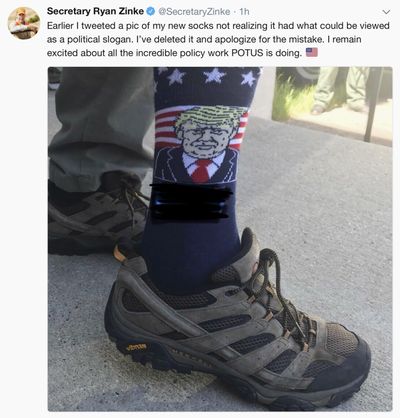 This screen shot posted Tuesday, June 26, 2018, on the official Twitter account of U.S. Interior Secretary Ryan Zinke shows him wearing socks with an image of President Trump and the campaign slogan “Make America Great Again,” which has been blacked out on the photo, during an official event in Keystone, S.D. After critics said the unaltered image could be a violation of the Hatch Act, he blacked out the slogan and reposted the image with an apology. (AP)
