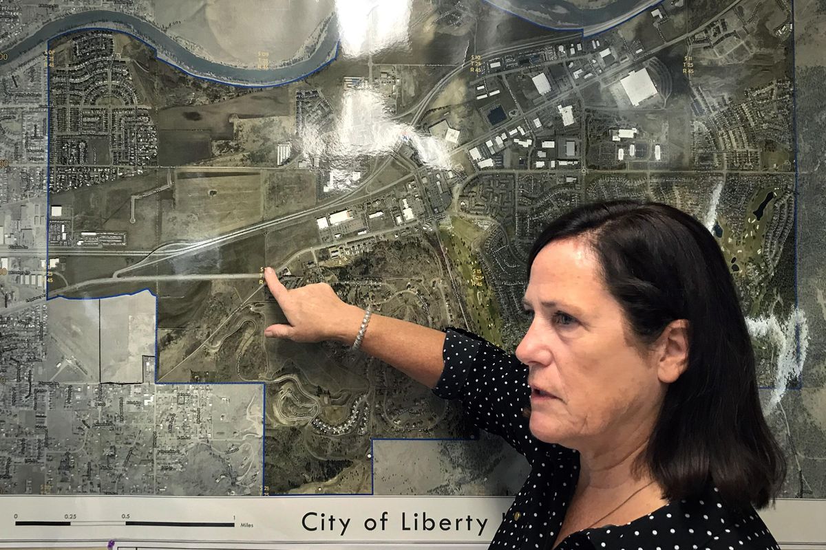 Katy Allen, city administrator for the City of Liberty Lake, points out Henry Road where the city would like to build their first road and bridge across I-90. (Dan Pelle / The Spokesman-Review)