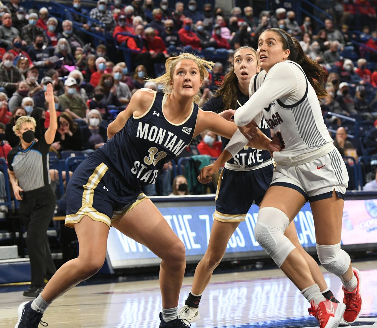 Gonzaga’s Melody Kempton, right, tries to get away Montana State’s Lindsey Hein (33), left, and Katelynn Limardo, center, while looking for a rebound under the basket during the Gonzaga matchup with Montana State Thiursday, Nov. 11, 2021 at McCarthey Athletic Center at Gonzaga University in Spokane, Washington.  (Jesse Tinsley/The Spokesman-Review)