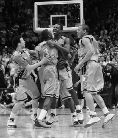 
Georgetown's Jeff Green, second from right, is congratulated after hitting winning shot.
 (The Spokesman-Review)