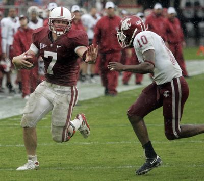 Stanford running back Toby Gerhart prepares to fend off Washington State cornerback Romeo Pellum on the way to a second-quarter touchdown during Saturday’s Pac-10 play in Stanford, Calif. (Associated Press / The Spokesman-Review)