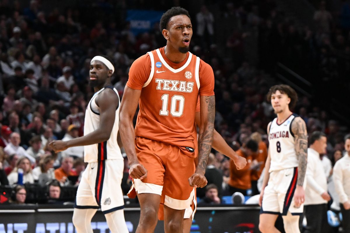 Texas forward Nic Codie, center, flexes after forcing a timeout against the Gonzaga Bulldogs on Saturday at the NCAA Tournament in Portland.  (Tyler Tjomsland / The Spokesman-Review)