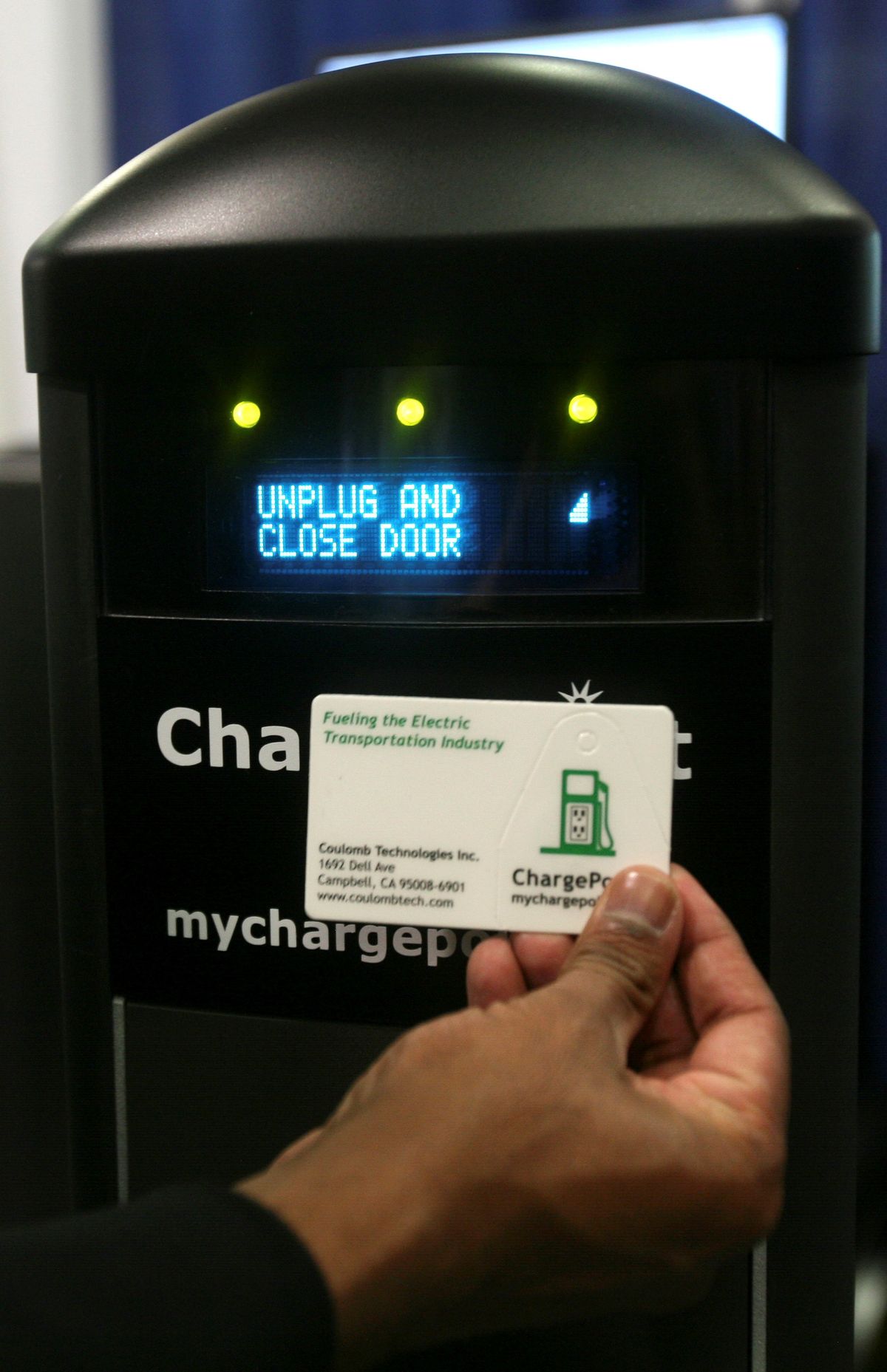 Praveen Mandal, president of Coulomb Technologies, demonstrates how to use a Smartlet charging station for a plug-in hybrid vehicle. (The Spokesman-Review)