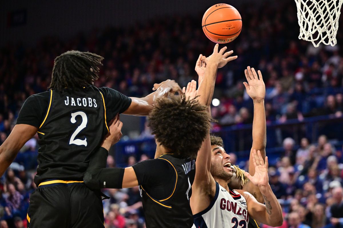 Gonzaga Bulldogs forward Anton Watson (22) fights to the hoop through the Kent State Golden Flashes during the first half of a college basketball game on Monday, Dec. 5, 2022, at McCarthey Athletic Center in Spokane, Wash.  (Tyler Tjomsland/The Spokesman-Review)