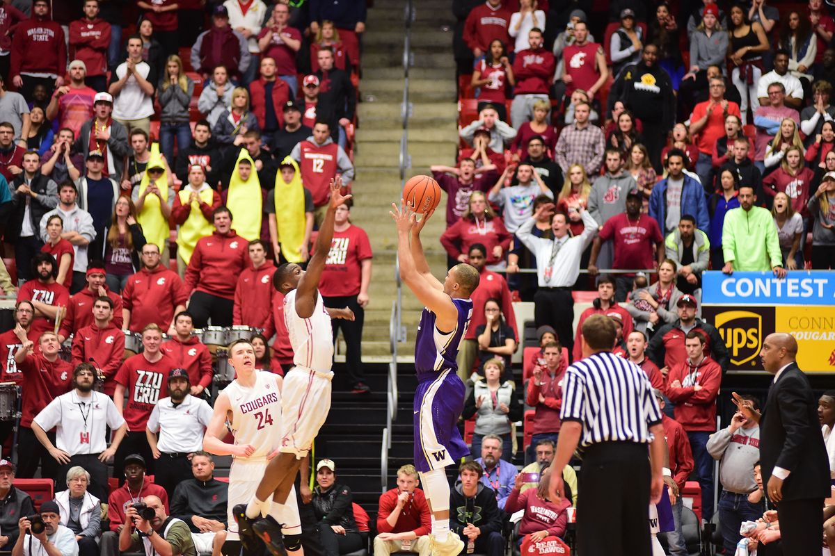 Washington’s Andrew Andrews, right, puts in the game-winning 3-pointer over Ike Iroegbu. (Tyler Tjomsland)