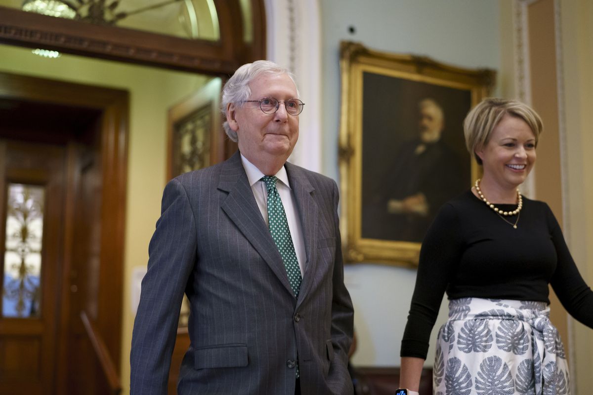 Senate Minority Leader Mitch McConnell, R-Ky., leaves the chamber, joined by top aide Stefanie Muchow, right, as lawmakers work to advance the $1 trillion bipartisan bill, at the Capitol in Washington, Thursday, Aug. 5, 2021.  (J. Scott Applewhite)
