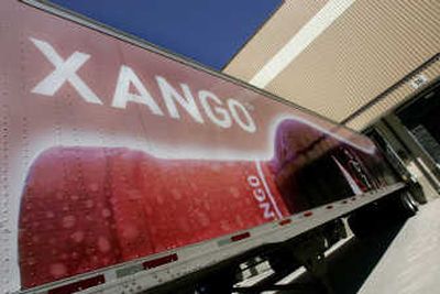 
Associated Press A XanGo trailer is filled with product at the company's distribution warehouse Tuesday in Spanish Fork, Utah. More than 33 semi-trucks leave the warehouse every day.
 (Associated Press / The Spokesman-Review)