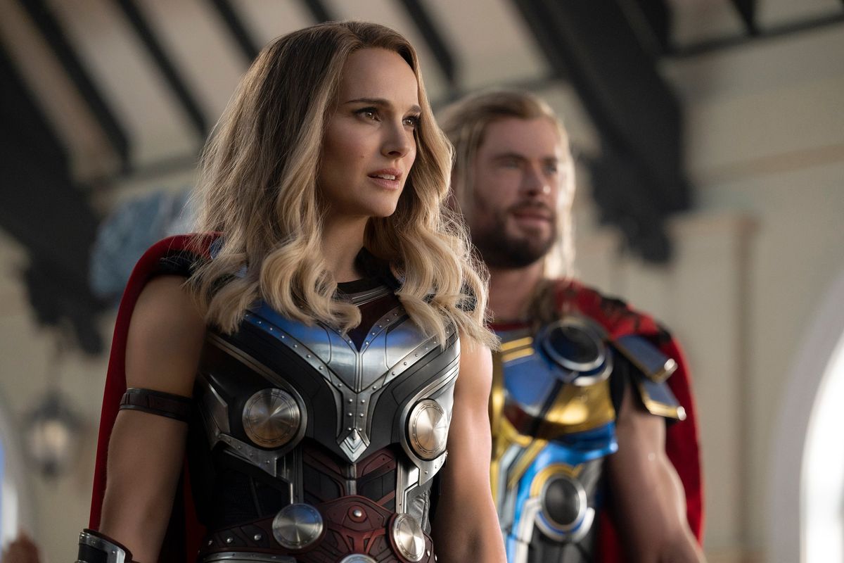 Natalie Portman, left, and Chris Hemsworth in “Thor: Love and Thunder.”  (Jasin Boland/Marvel Studios)