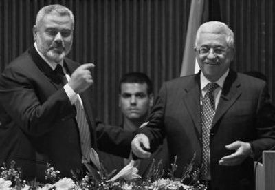 
Palestinian Prime Minister Ismail Haniyeh, left, stands with Palestinian Authority President Mahmoud Abbas after Abbas' speech Saturday at a special session of parliament. 
 (Associated Press / The Spokesman-Review)