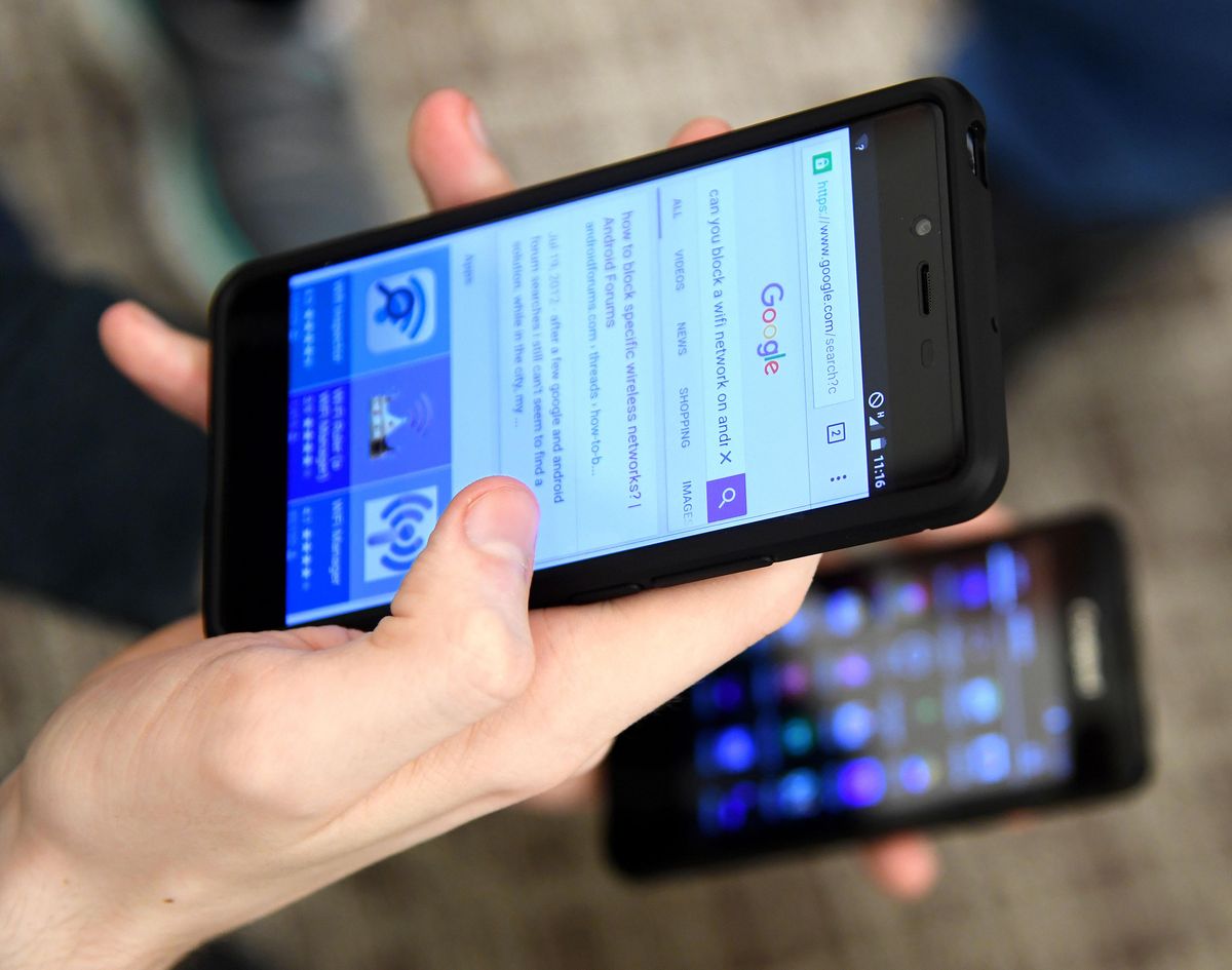 FILE – A college student uses a cellphone on Sept. 14, 2016, at the Clare View Seniors Community Room in Spokane. (Dan Pelle / The Spokesman-Review)