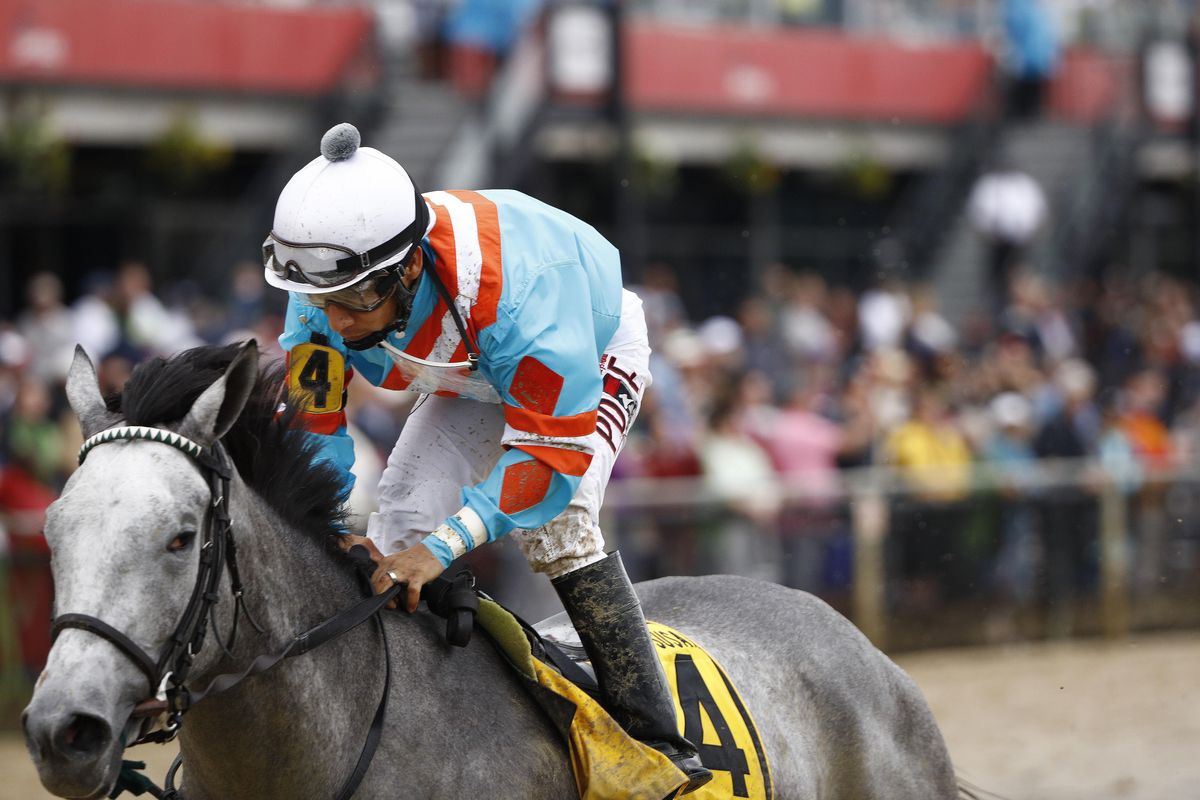 Red Ruby with Paco Lopez aboard wins the Black-Eyed Susan horse race at Pimlico race track, Friday, May 18, 2018, in Baltimore. The 143rd running of the Preakness Stakes race runs Saturday. (Steve Helber / Associated Press)