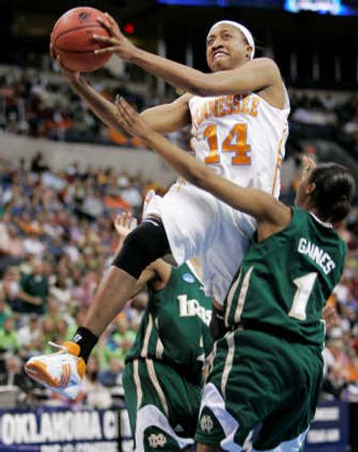 
Tennessee guard Alexis Hornbuckle gets by Notre Dame's Tulyah Gaines for two of her eight points in regional semifinal.Associated Press
 (Associated Press / The Spokesman-Review)