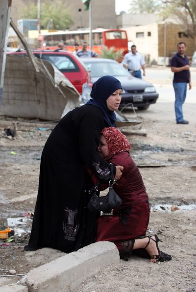 A woman reacts near the site of a bomb explosion in Baghdad on Thursday.  (Associated Press / The Spokesman-Review)