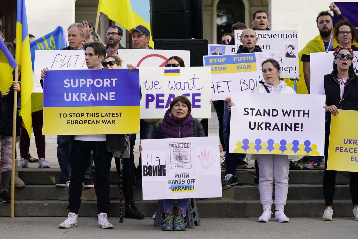 FILE— Members of the Ukrainian community and others gathered at the state Capitol to protest the Russian invasion of Ukraine at a rally n Sacramento, Calif., Thursday, Feb. 24, 2022. Roughly 18,000 Ukrainians live in the Sacramento region and the area is preparing for the possibility of many more Ukrainians arriving after U.S. President Joe Biden announced the nation will accept up to 100,000 refugees from the country.  (Rich Pedroncelli)