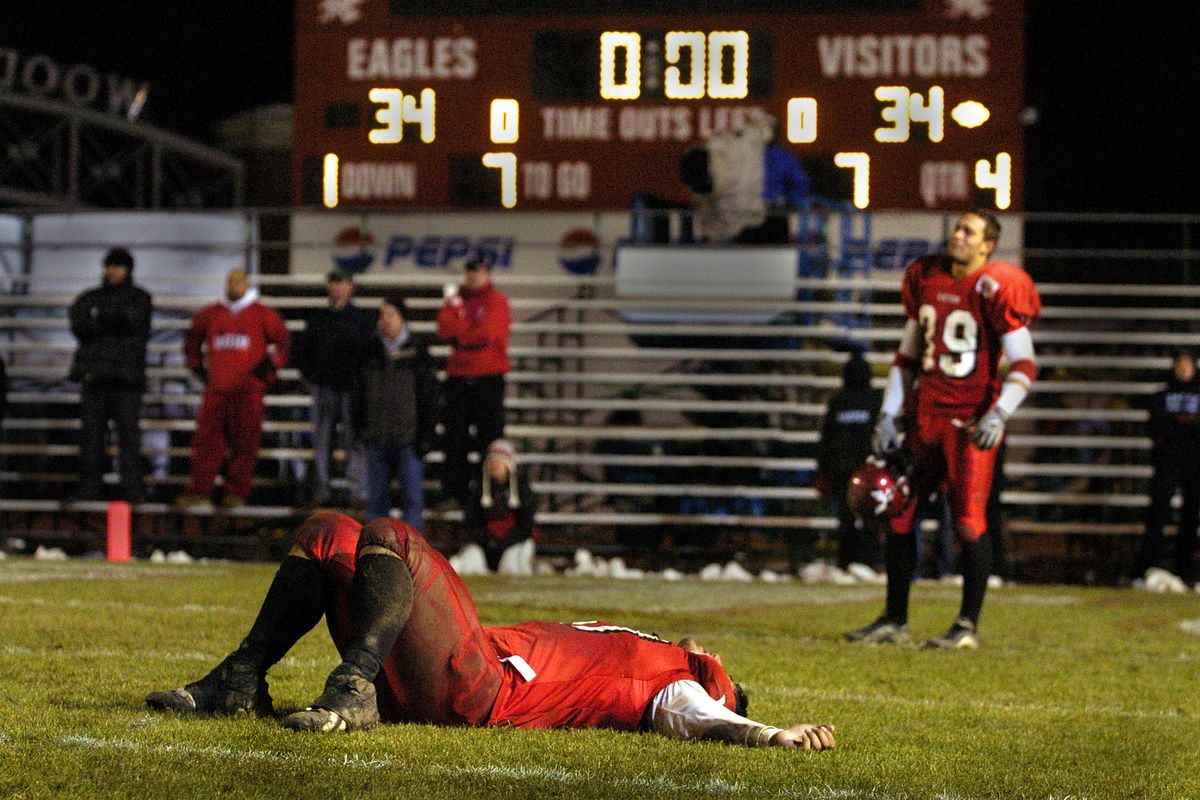EWU lineman Harrison Nikolao and defensive back Nick Denbeigh, right, show the emotion of the Eagles last second 35-34 loss to Sam Houston State in Cheney on Saturday, Dec. 4, 2004. The Eagles were unable to stop Sam Houston who went the length of the field and scored the winning touchdown with only seconds on the clock after trailing EWU all game. (Christopher Anderson / The Spokesman-Review)