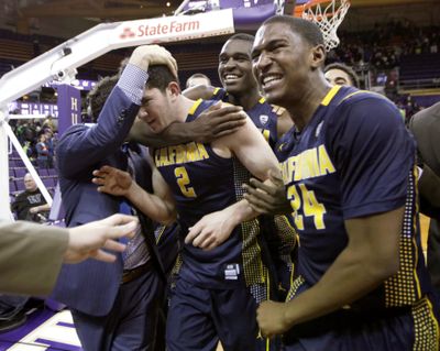 California's Sam Singer (2) is mobbed by his team after hitting game-winning shot. (Associated Press)