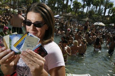 
Cindy Cesare displays hotel keys from various hotels she uses to sneak into pools on and near the Las Vegas Strip. 
 (Associated Press / The Spokesman-Review)