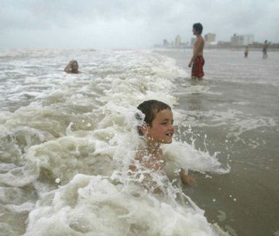 
Garrett Peri, 8, of Wylie, Texas, plays in post-Hurricane Emily waves Wednesday on South Padre Island, Texas.
 (Associated Press / The Spokesman-Review)