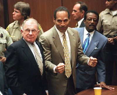 Murder defendant O.J. Simpson, center, listens to the not guilty verdict with his attorneys F. Lee Bailey, left, and Johnnie Cochran Jr. Simpson was found not guilty of killing his ex-wife Nicole Brown-Simpson and her friend Ron Goldman. (Myung J. Chun/AFP via Getty Images/TNS)  (Myung J. Chun/AFP/Getty Images North America/TNS)