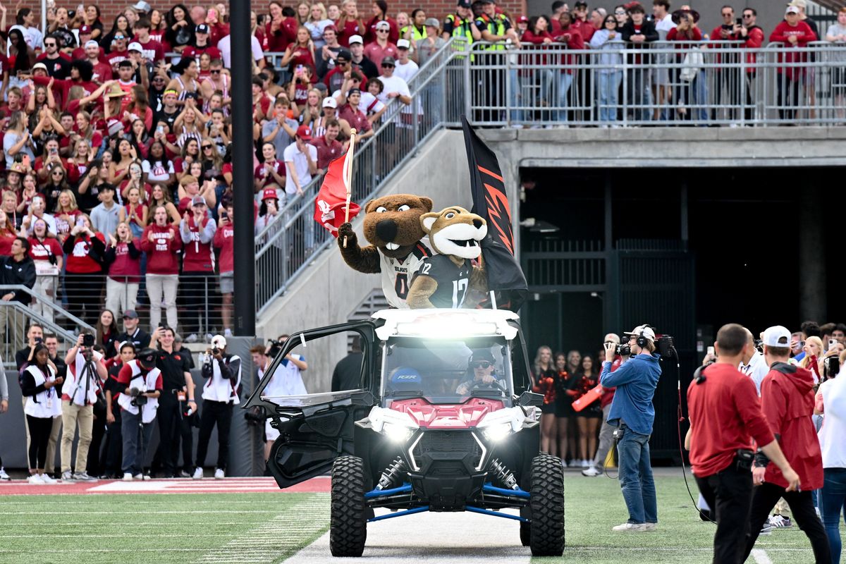 Mascots Butch of Washington State and Benny Beaver of Oregon State Beavers take to the field together before the Sept. 23 football game at Gesa Field in Pullman.   (Tyler Tjomsland/The Spokesman-Review)