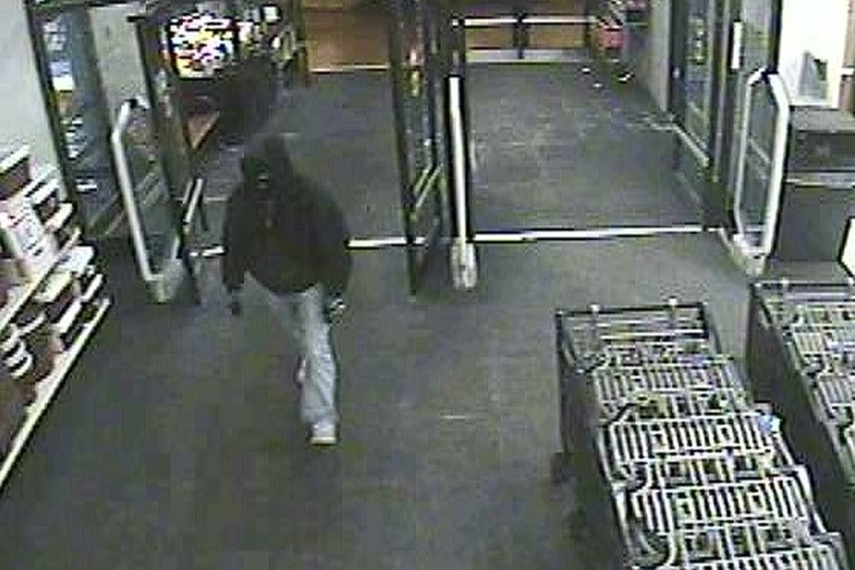 Surveillance footage from Shopko at 9520 N. Division shows a masked man robbing the pharmacy of OxyContin at gunpoint Tuesday evening. The same man is suspected of an attempted robbery at a pay day loan center earlier that day, and of four robberies in January.