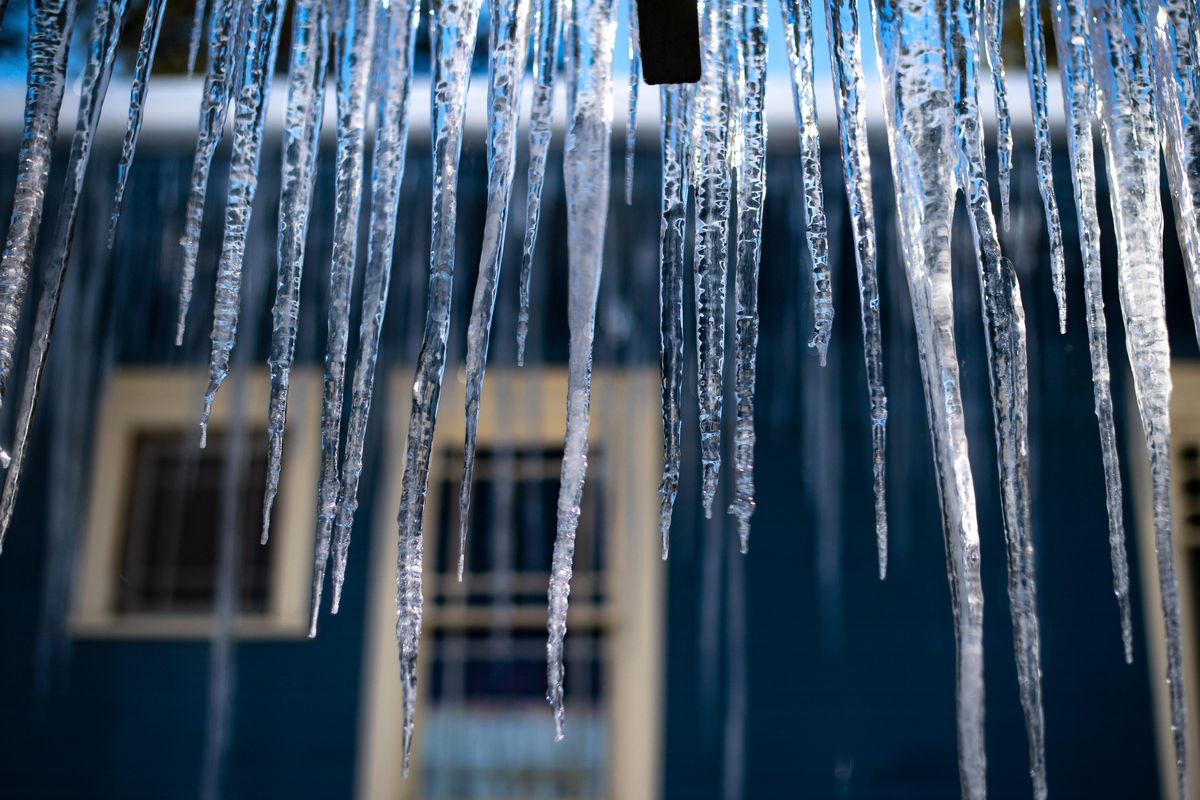 Icicles hanging from a South Hill home, melt in sun, Thursday, Feb. 21, 2019. (Colin Mulvany / The Spokesman-Review)