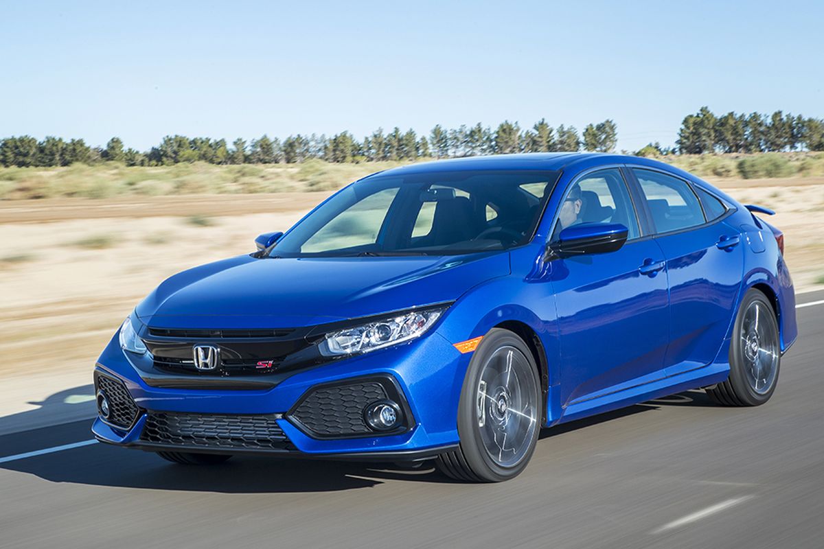 The Si is available in sedan and coupe body styles, both priced at $23,900, and both tricked out with black-out grilles, gloss-black trim, cats-eye headlamps and crimped and bent sheet metal. (Honda)