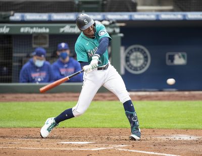 The Seattle Mariners' Kyle Lewis rips a solo home run in the second inning against the Texas Rangers on Friday, Aug. 21, 2020, at T-Mobile Park in Seattle. The Mariners won, 7-4.  (Seattle Times)