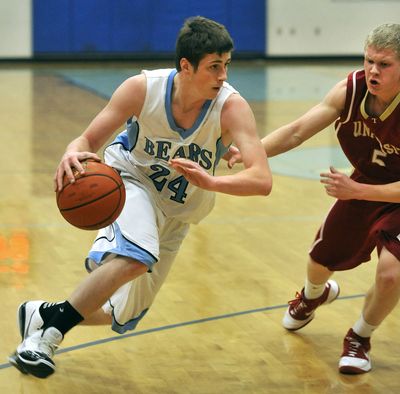 Central Valley’s Tyler Chamberlain (24) blasts past University’s Justin Donahue during a game Jan. 11. (Dan Pelle)