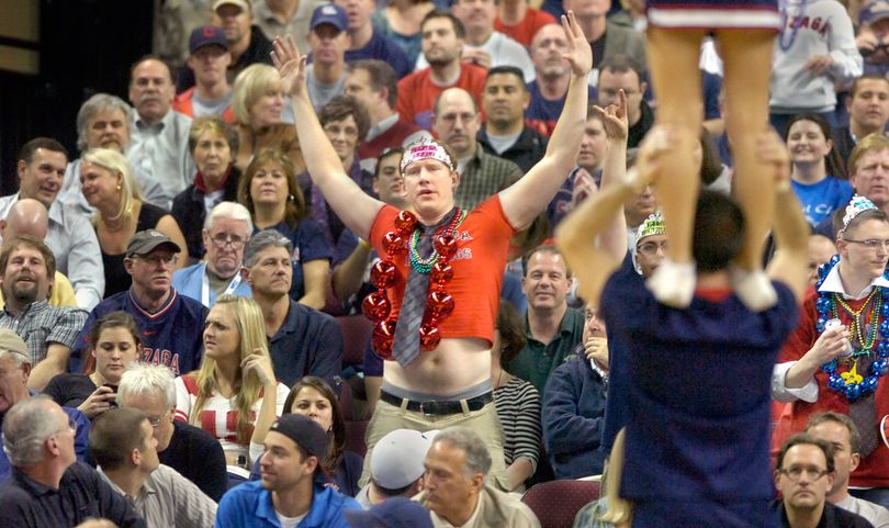 Fans watch the Gonzaga cheerleaders and turn to catch the act of Justin Padley during a timeout Monday night March 9, 2009 at the WCC tournament championship game in the Orleans Arena in Las Vegas.  Padley and the cheer squad can take their moves to the Big Dance as Gonzaga beat St. Mary's to win the league automatic berth in the NCAA tournament.  CHRISTOPHER ANDERSON The Spokesman-Review (Christopher Anderson / The Spokesman-Review)