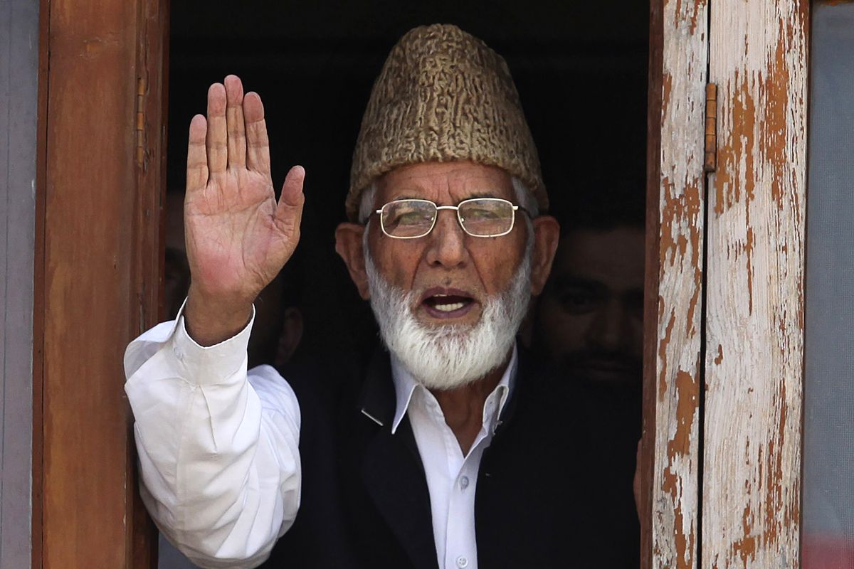 CORRECTS AGE - FILE - In this Wednesday, Sept. 8, 2010, file photo, Kashmiri separatist leader Syed Ali Shah Geelani waves to the media before his arrest in Srinagar, India. Geelani, an icon of disputed Kashmir’s resistance against Indian rule and a top separatist leader who became the emblem of the region’s defiance against New Delhi, died late Wednesday, Sept, 1, 2021. He was 91.  (Altaf Qadri)