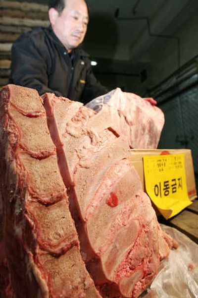
An Agriculture Ministry officer shows a piece of banned bone Friday in Yongin, south of Seoul, South Korea. Associated Press
 (Associated Press / The Spokesman-Review)