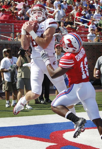 WSU receiver Jared Karstetter hauls in a pass on Saturday. (John F. Rhodes)