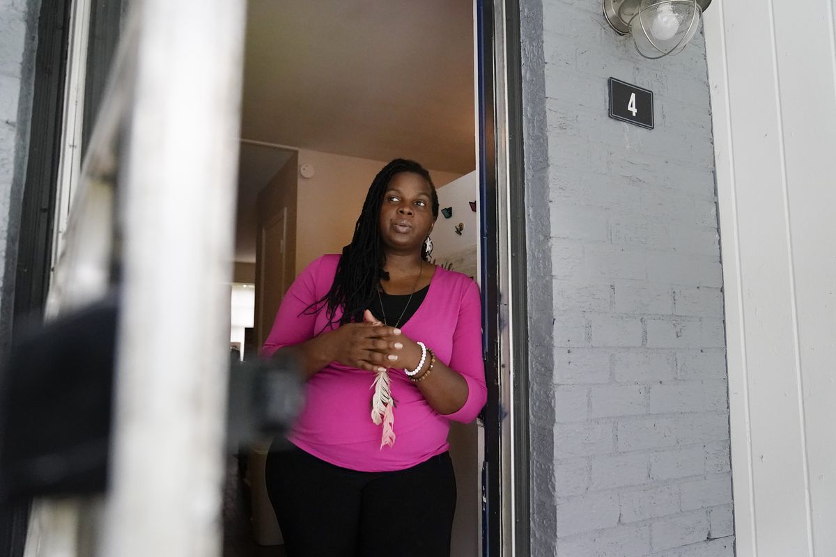Dylyn Price looks out a doorway from her kitchen at her rented townhome on Tuesday, June 22, 2021, in Athens, Ga. A rental crisis spurred by the pandemic prompted many states to make bold promises to help renters, but most failed to deliver on them after Congress passed the sweeping CARES Act in March 2020. Price said she got about $5,800 in rental assistance but that may not prevent her from losing her home. "It