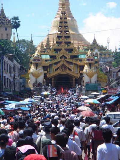 
People march toward a temple Tuesday to protest against the military government in Yangon, Myanmar,  on the eighth day of street demonstrations. Associated Press
 (Associated Press / The Spokesman-Review)