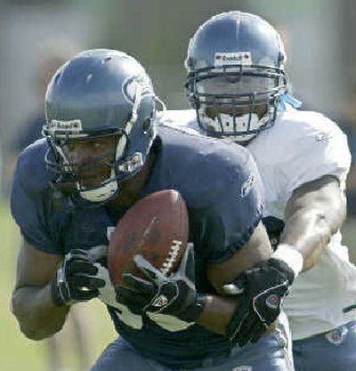 
Seahawks fullback Mack Strong, left, took a break from his training camp duties to talk af2 football. 
 (Jim Bryant Associated Press / The Spokesman-Review)