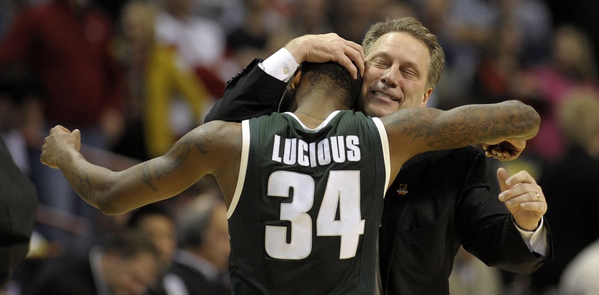 Michigan State coach Tom Izzo hugs Korie Lucious after his winning 3-pointer. (Associated Press)