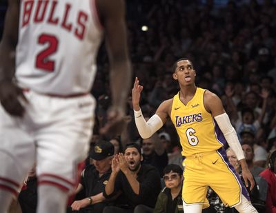 Los Angeles Lakers guard Jordan Clarkson, right, celebrates his 3-pointer during a game against the Chicago Bulls on Tuesday. (Kyusung Gong / Associated Press)