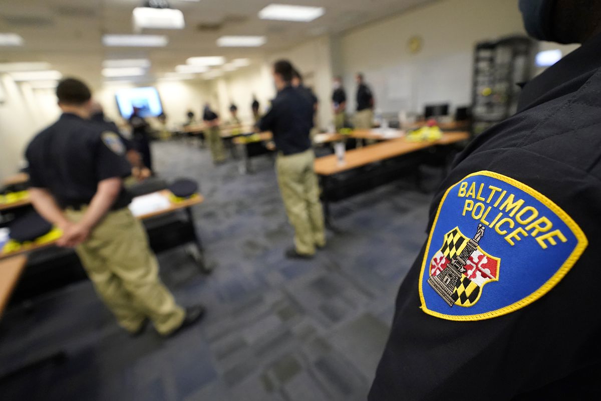 In this Sept. 9, 2020, photo Baltimore Police Academy cadets listen to an instructor during a class focusing on procedural justice in Baltimore.  (Julio Cortez)