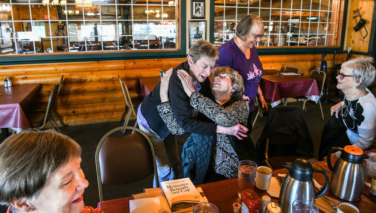 Former Deaconess nurses, from left, Donna Pierce, Dorothy Feldman, Pam Conine, Nora Nikkola and Judy Free greet and hug as they gather for breakfast at the Longhorn BBQ in Airway Heights.  (DAN PELLE/THE SPOKESMAN-REVIEW)